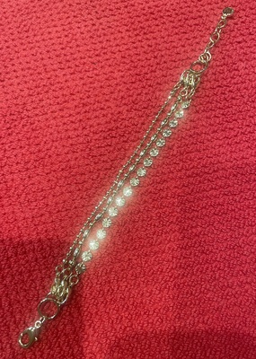 Gold, 3 strand bracelet with a crystal clasp